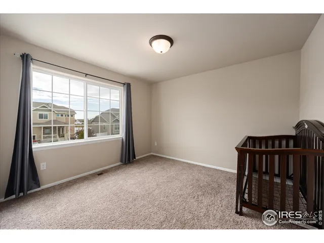 a bathroom with a sink a toilet a mirror and shower
