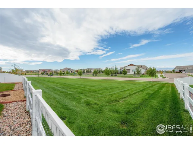 a kitchen with a sink and a refrigerator