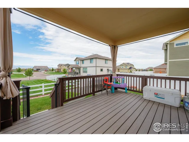 a view of balcony with wooden floor