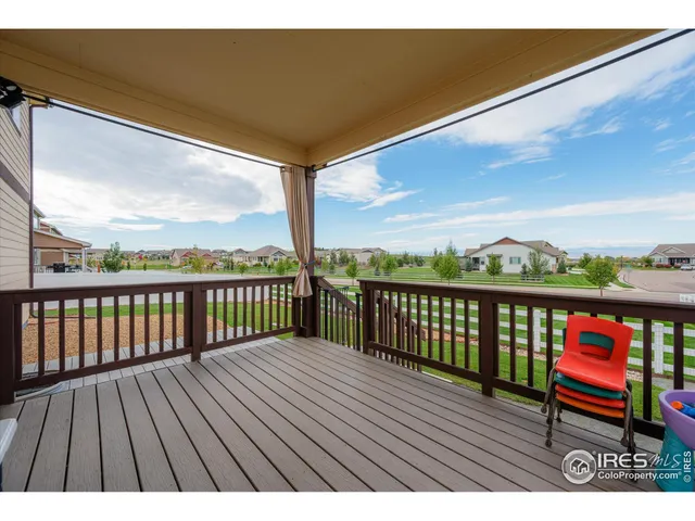 a view of a balcony with wooden floor