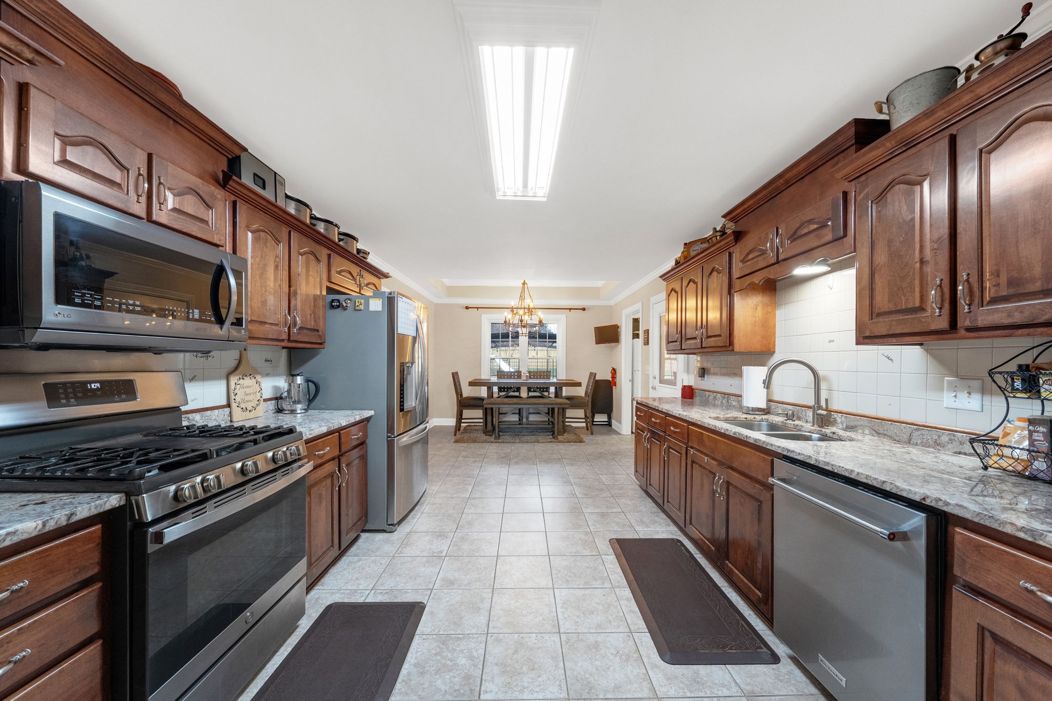 495 Favre Circle Winchester, TN 37398 - Photo 11 of 31 a large kitchen with stainless steel appliances granite countertop a stove and a sink