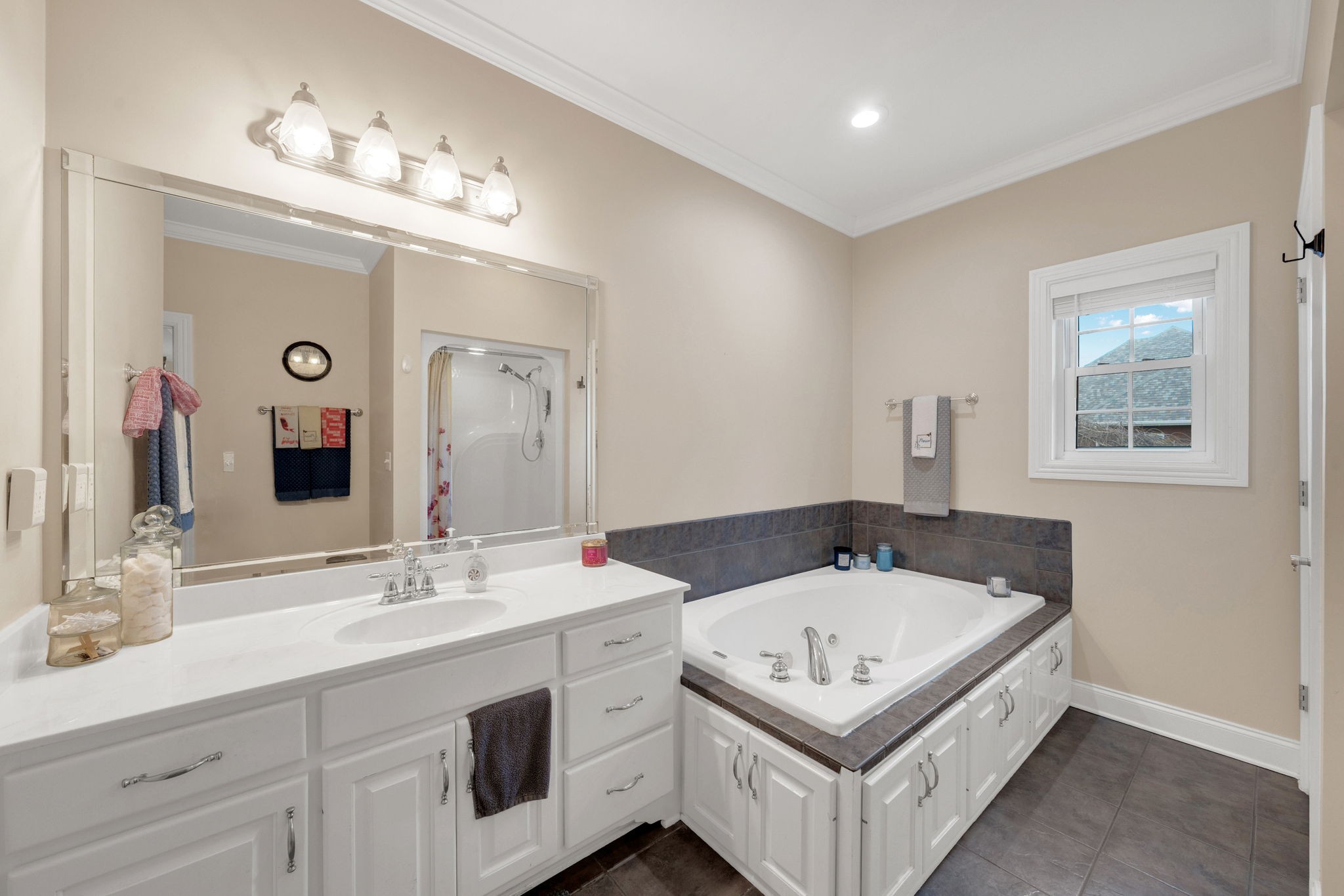 495 Favre Circle Winchester, TN 37398 - Photo 18 of 31 a bathroom with a sink a chandelier and mirror