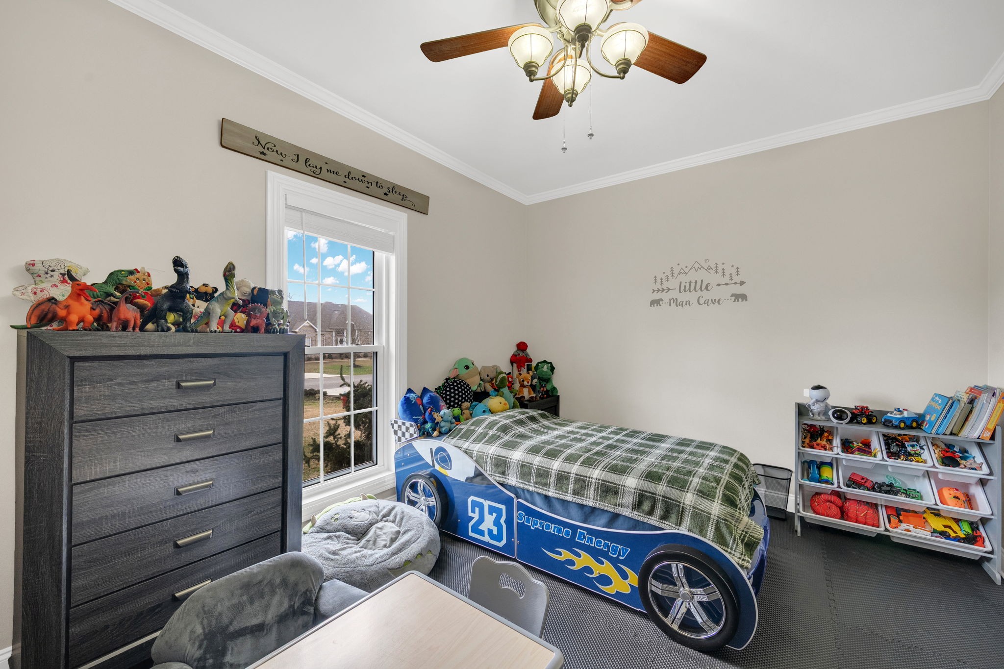 495 Favre Circle Winchester, TN 37398 - Photo 20 of 31 a bedroom with a bed and a chandelier