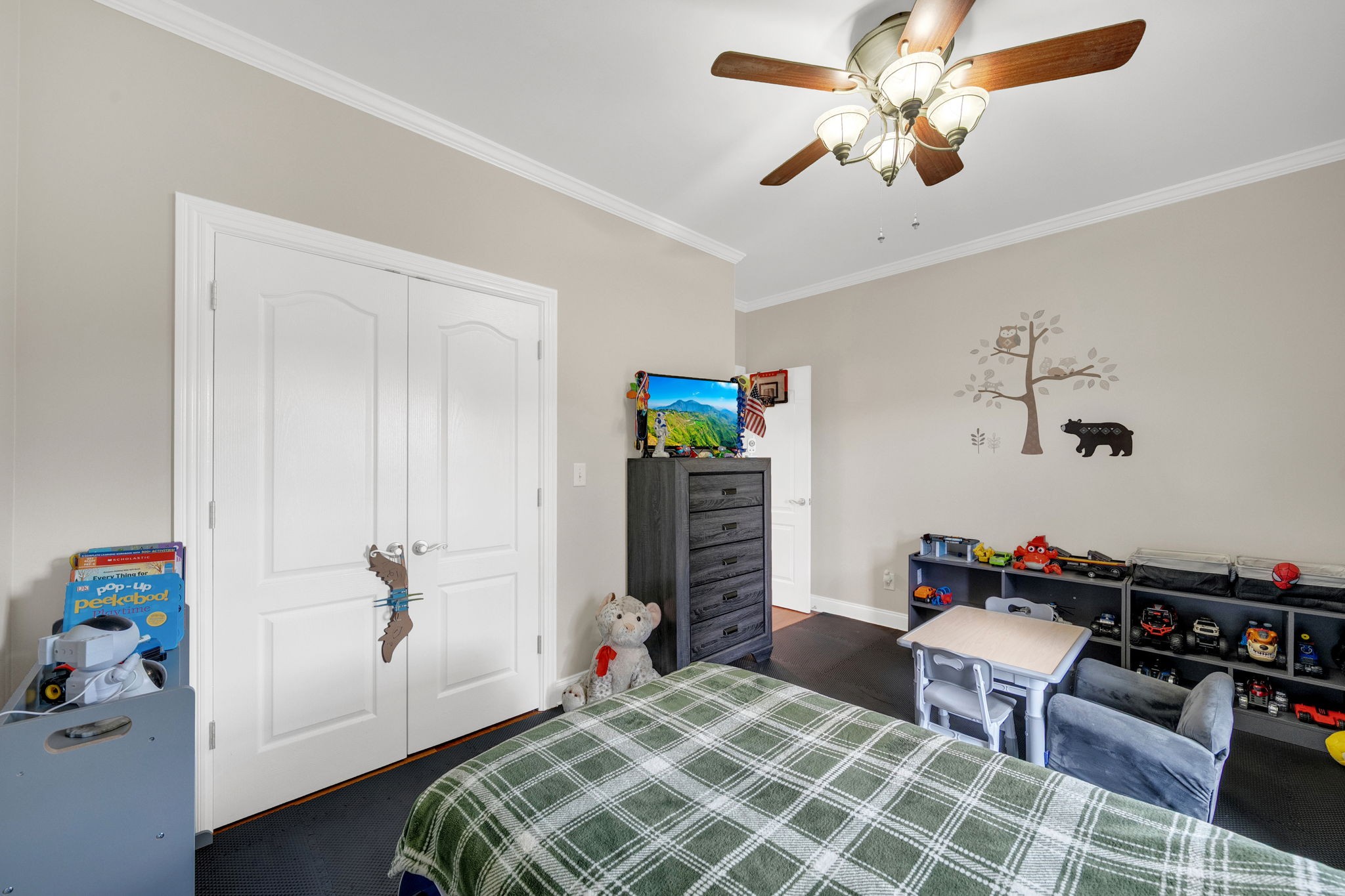 495 Favre Circle Winchester, TN 37398 - Photo 21 of 31 a bedroom with a bed and a chandelier