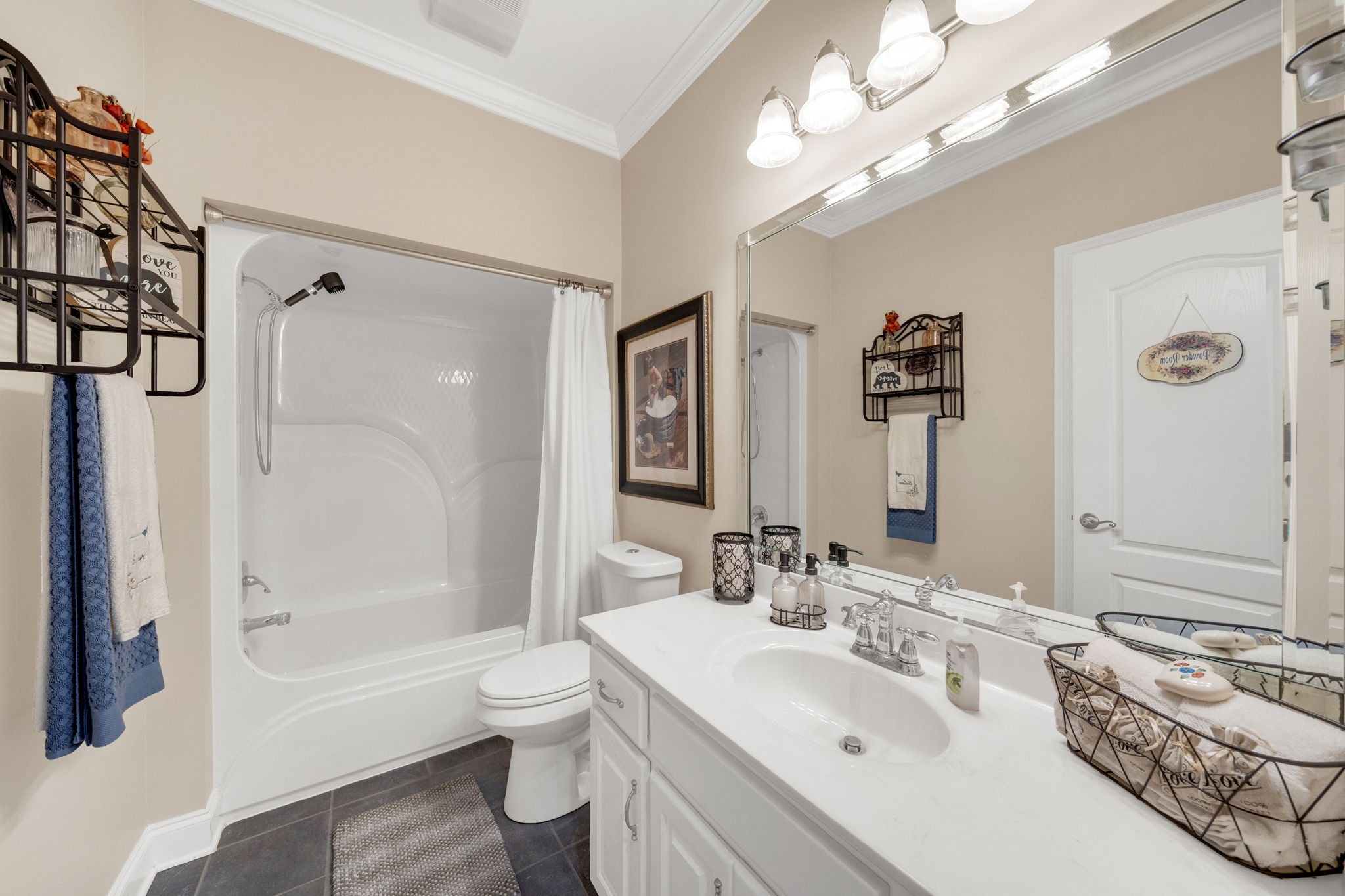 495 Favre Circle Winchester, TN 37398 - Photo 24 of 31 a bathroom with a bathtub a sink and a large mirror