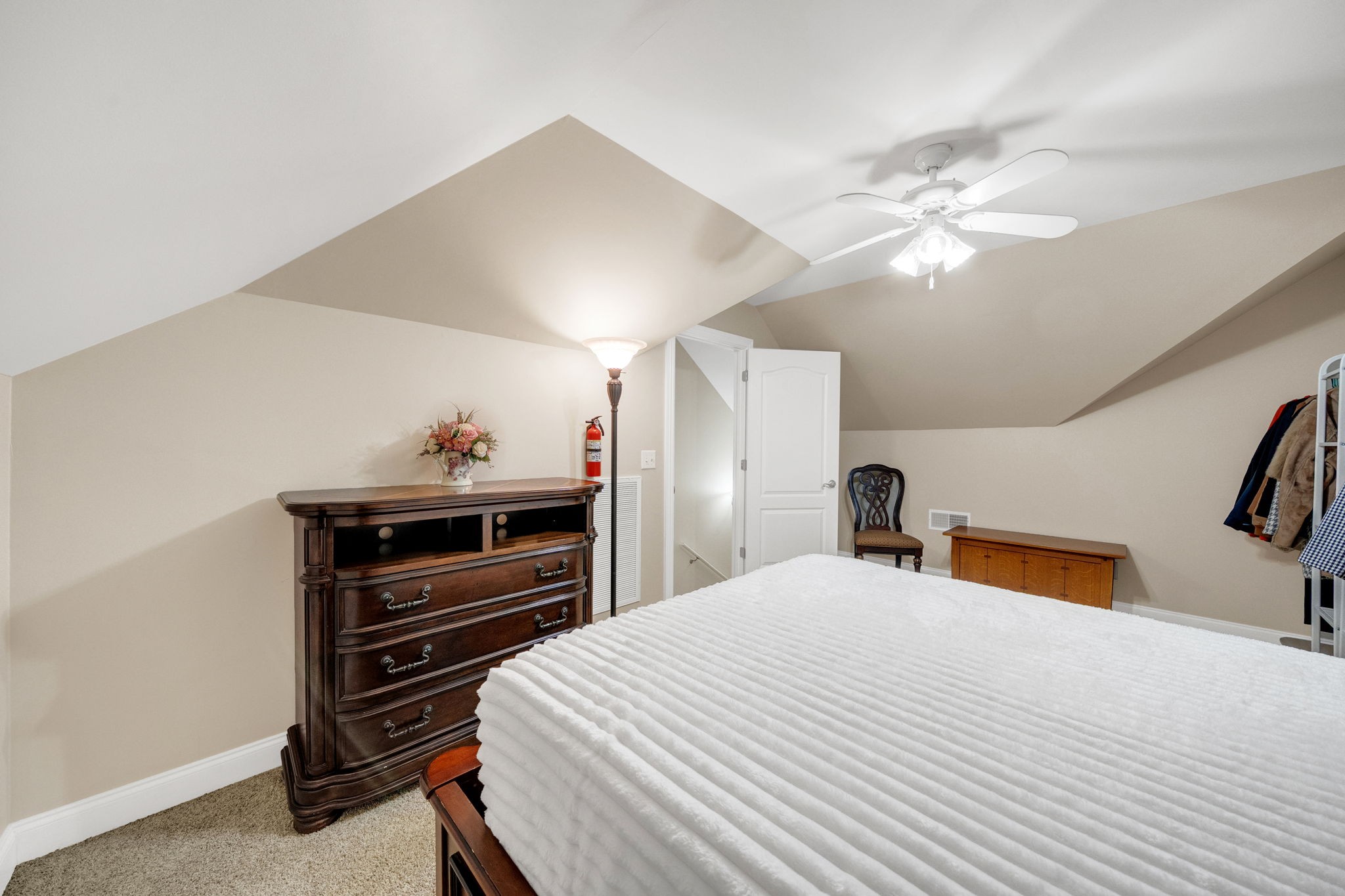 495 Favre Circle Winchester, TN 37398 - Photo 25 of 31 a bedroom with a bed and a chandelier