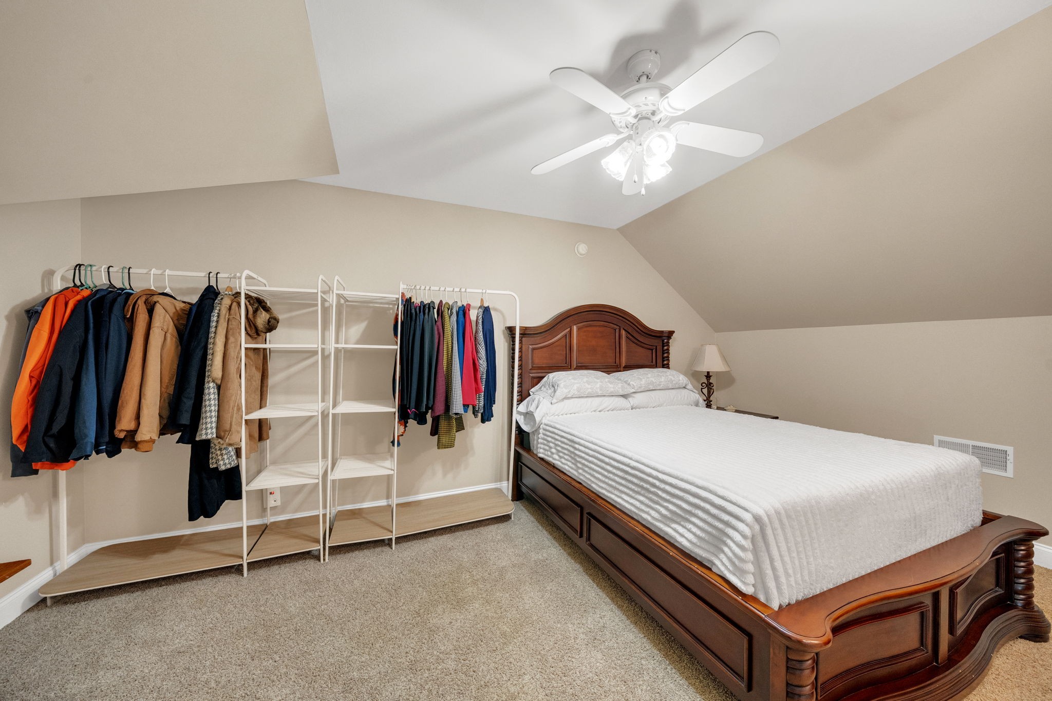 495 Favre Circle Winchester, TN 37398 - Photo 26 of 31 a bedroom with a bed and a chandelier