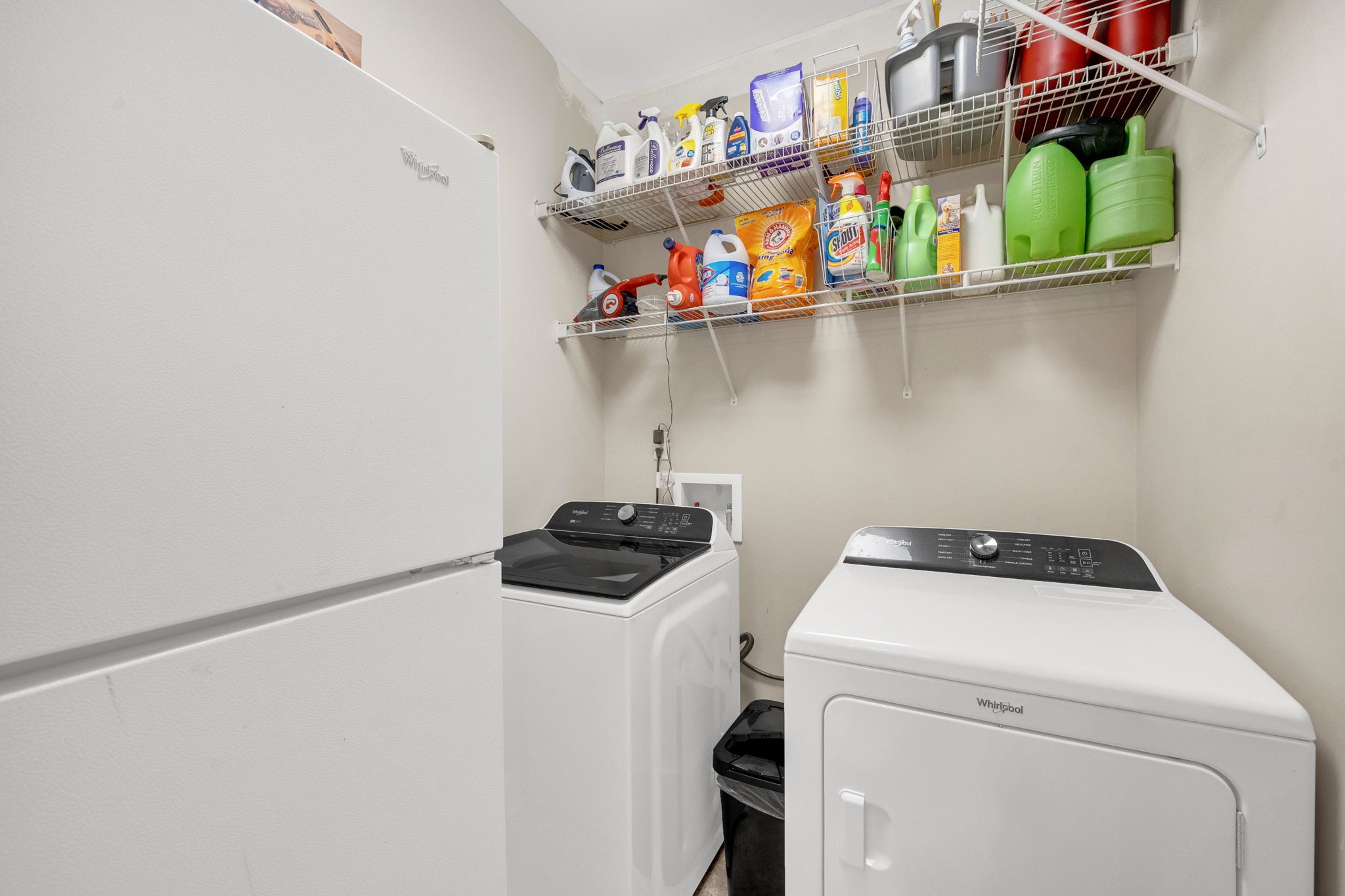 495 Favre Circle Winchester, TN 37398 - Photo 27 of 31 a utility room with dryer washer and a fridge