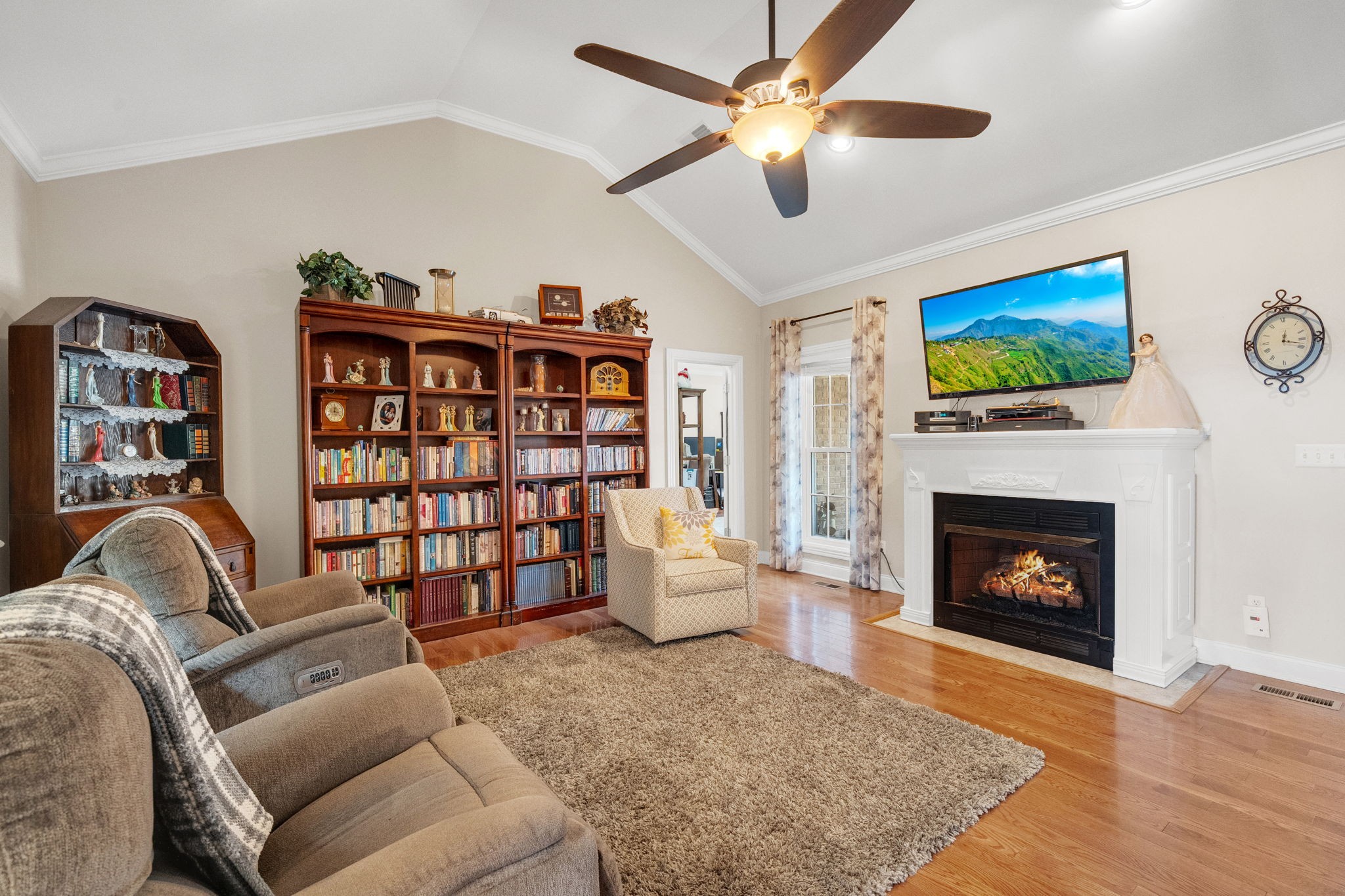 495 Favre Circle Winchester, TN 37398 - Photo 7 of 31 a living room with furniture a fireplace and a flat screen tv