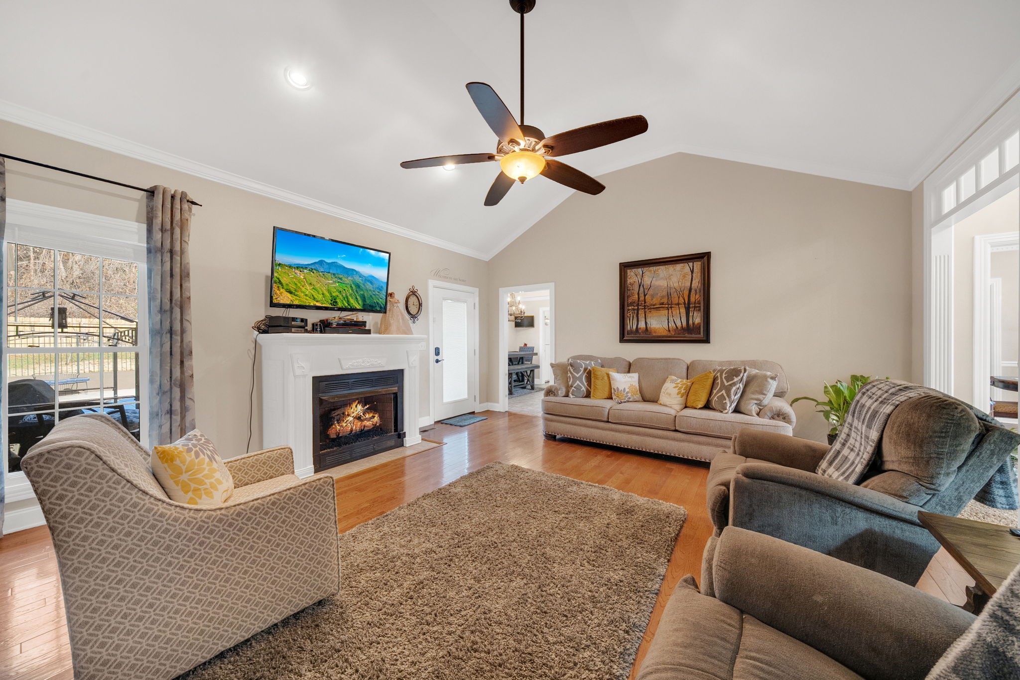 495 Favre Circle Winchester, TN 37398 - Photo 8 of 31 a living room with furniture a flat screen tv and a fireplace