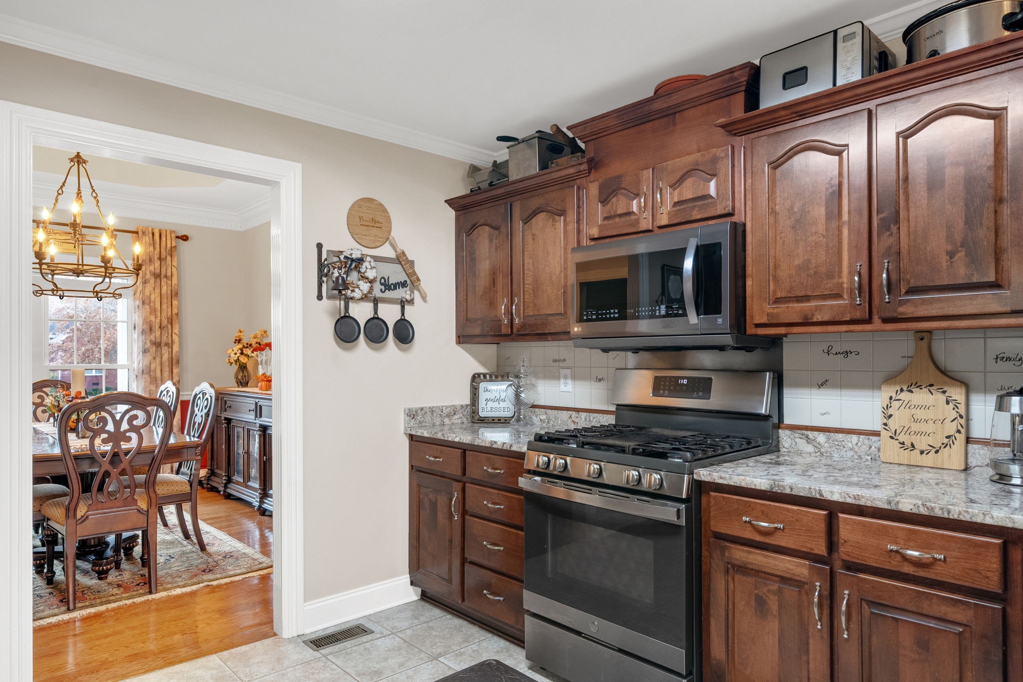 495 Favre Circle Winchester, TN 37398 - Photo 9 of 31 a kitchen with stainless steel appliances granite countertop a stove and a microwave