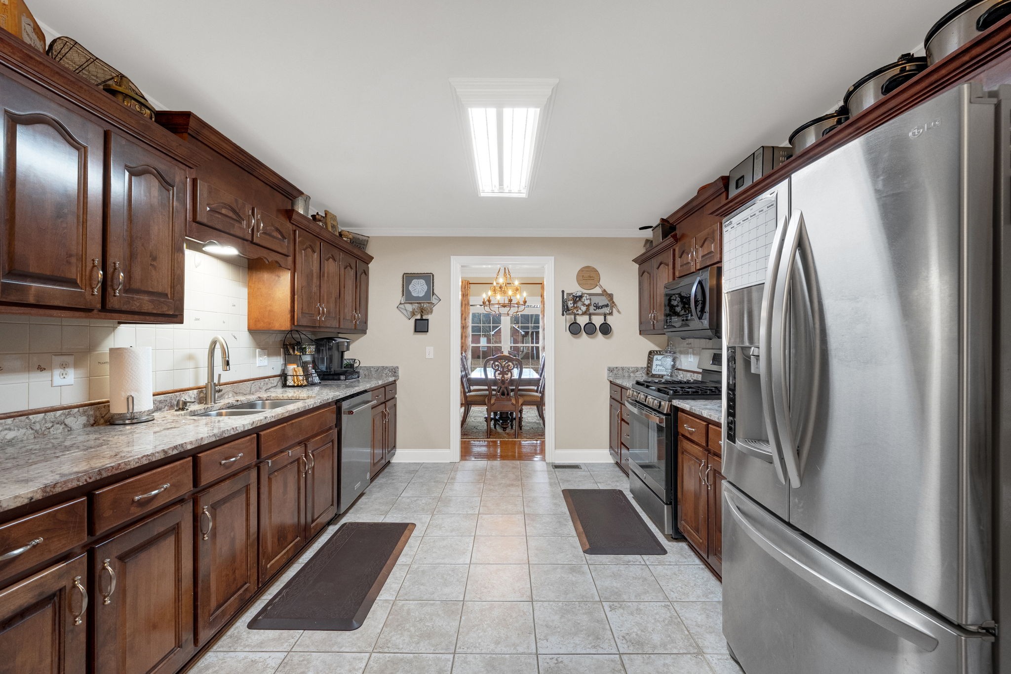 495 Favre Circle Winchester, TN 37398 - Photo 10 of 31 a large kitchen with stainless steel appliances granite countertop a refrigerator and a sink