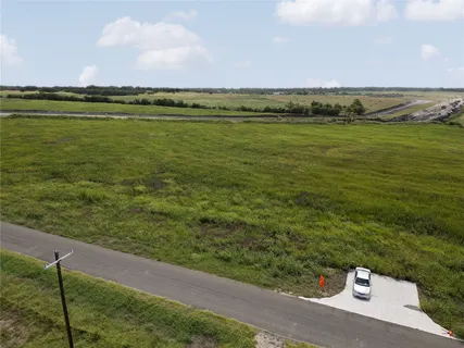 a view of a field with an ocean