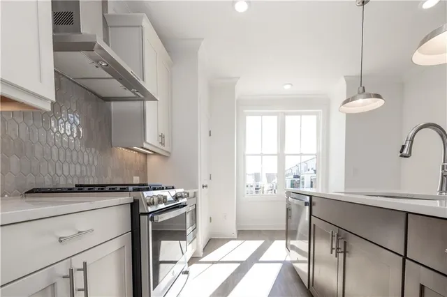 a bathroom with a double vanity sink a mirror and a shower