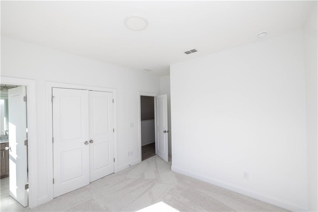 4223 Millcroft Place, Unit 211 Buford, GA 30518 - Photo 28 of 47 a view of an empty room