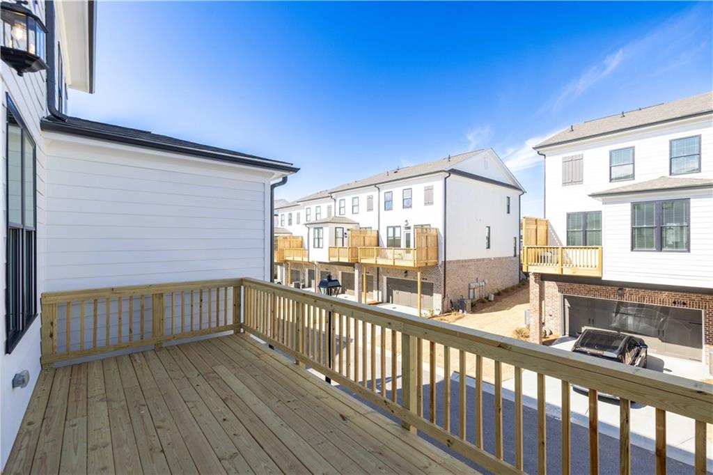 4223 Millcroft Place, Unit 211 Buford, GA 30518 - Photo 30 of 47 a view of a balcony with wooden floor