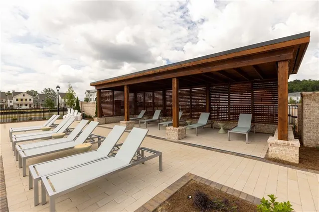 a view of a lake with outdoor seating