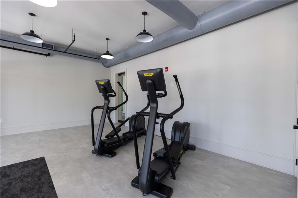 4223 Millcroft Place, Unit 211 Buford, GA 30518 - Photo 44 of 47 a view of a room with gym equipment