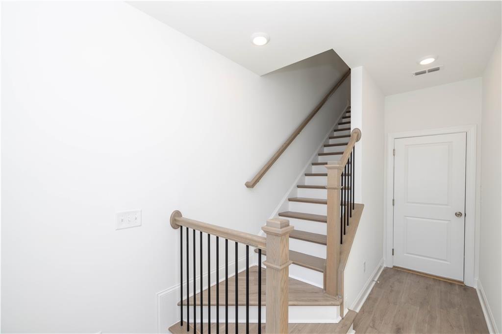 4223 Millcroft Place, Unit 211 Buford, GA 30518 - Photo 5 of 47 a view of entryway with stairs