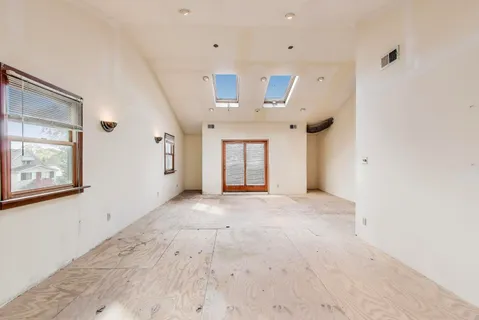 an empty room with windows