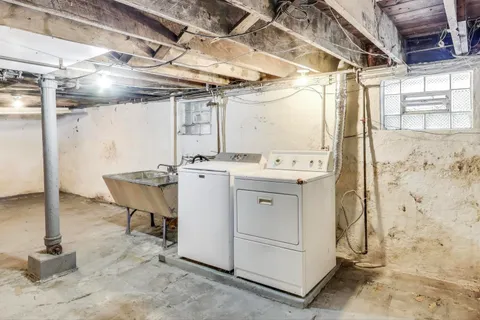 a view of a house with wooden fence