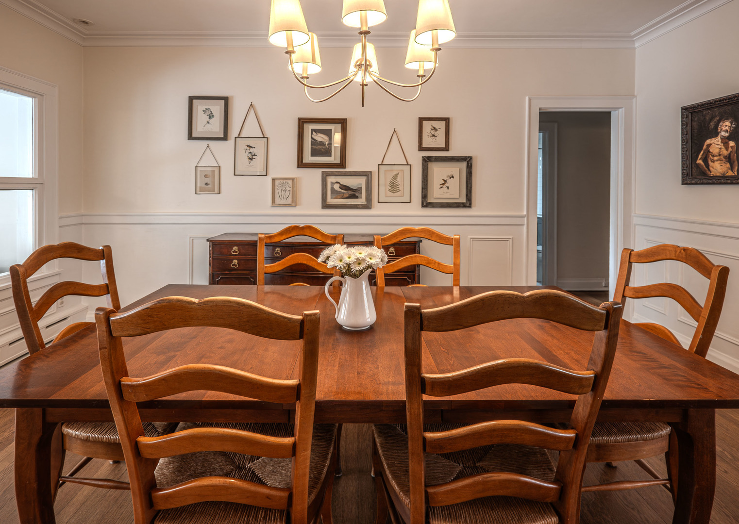 1204 Madison Street Evanston, IL 60202 - Photo 16 of 56 a view of a dining room that has a table and chairs in it