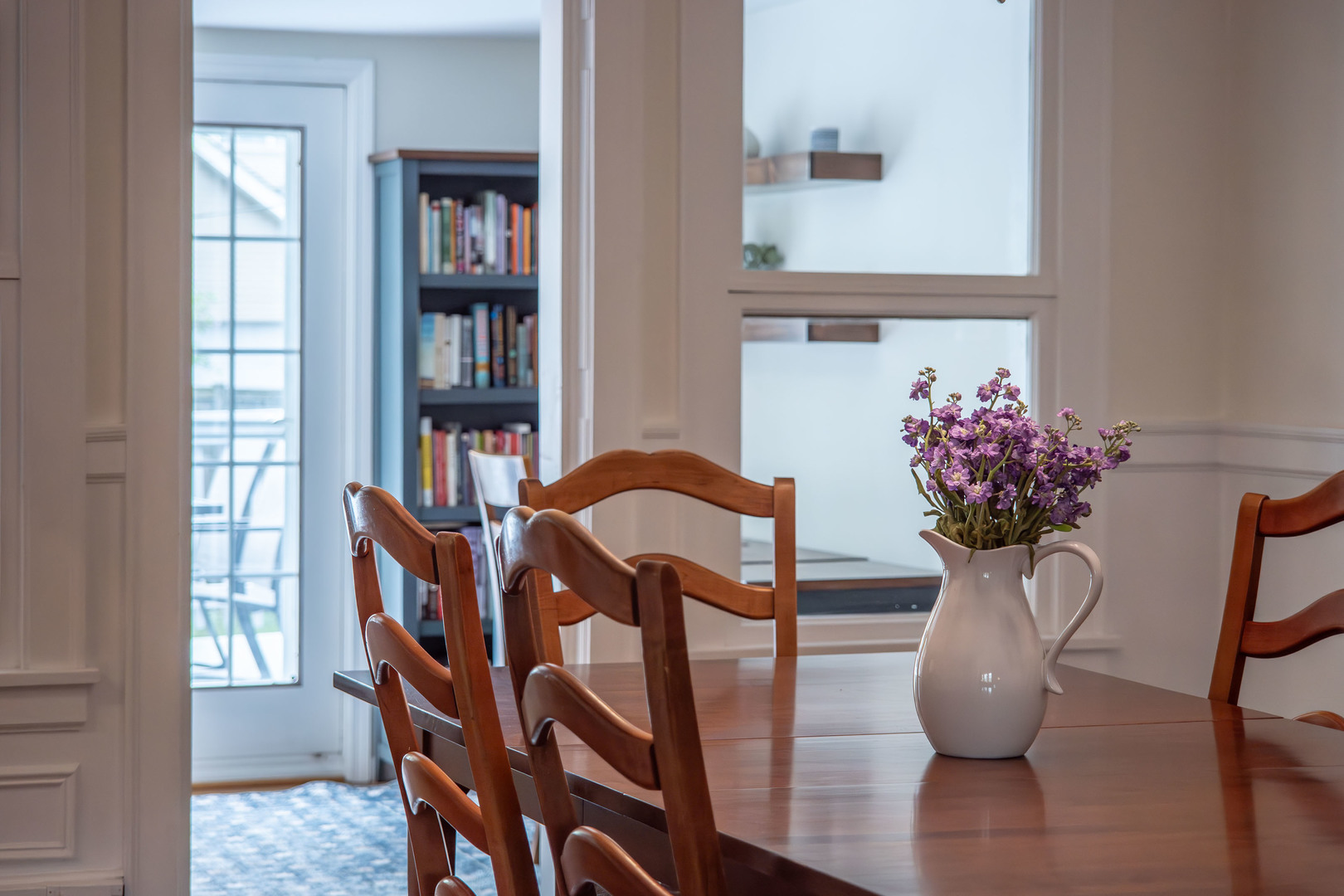 1204 Madison Street Evanston, IL 60202 - Photo 17 of 56 a view of a dining room with furniture and a potted plant