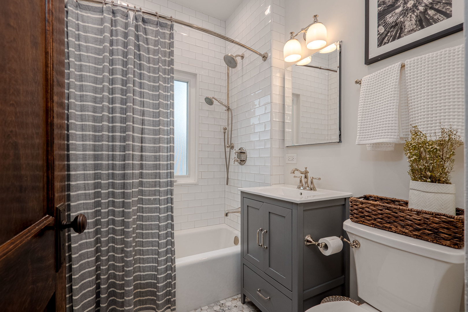 1204 Madison Street Evanston, IL 60202 - Photo 33 of 56 a bathroom with a sink a toilet a mirror and shower