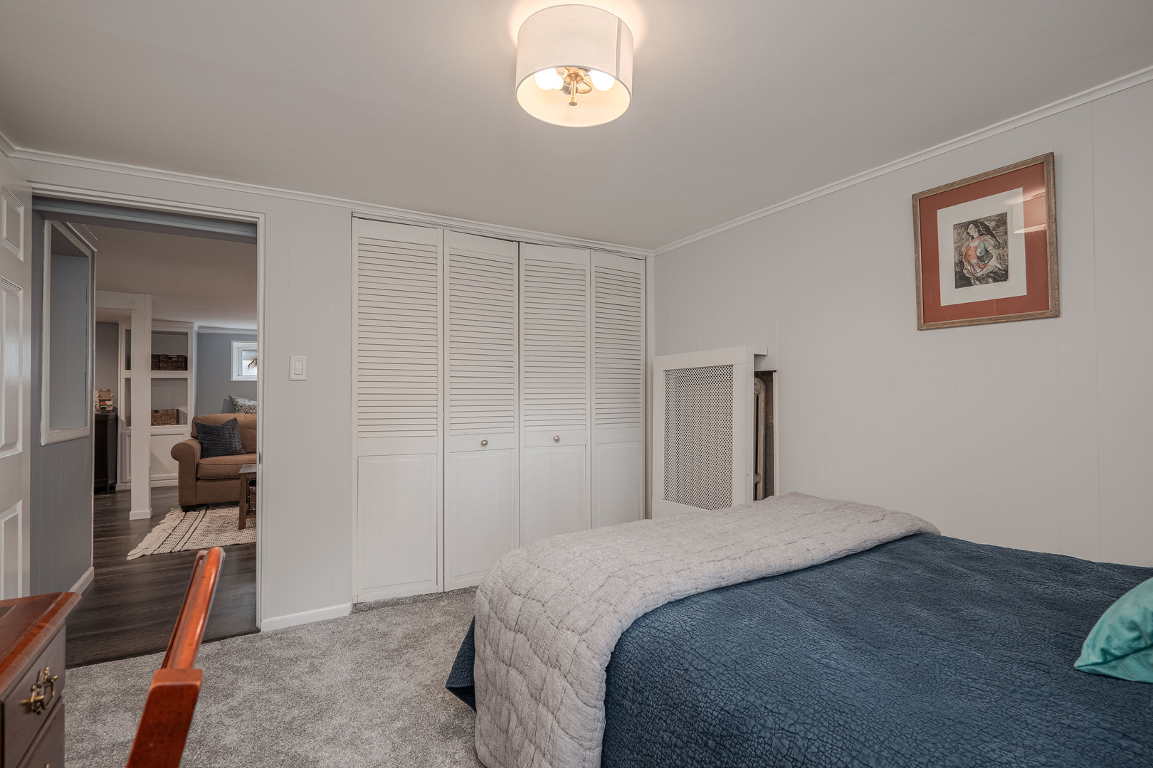 1204 Madison Street Evanston, IL 60202 - Photo 43 of 56 a bedroom with a bed and a chandelier