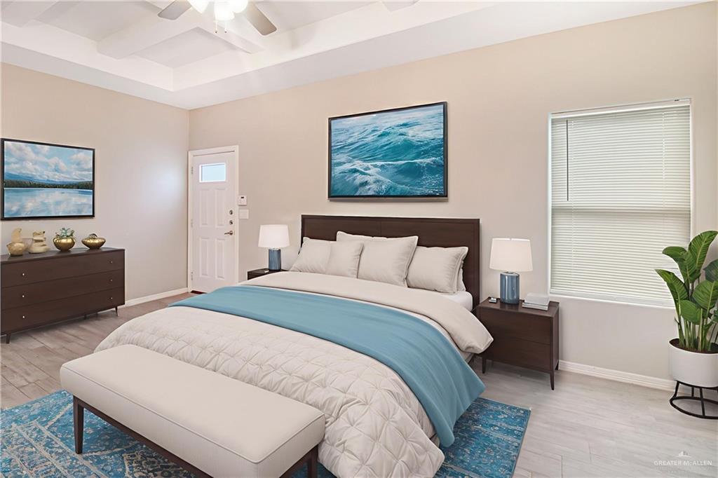 1817 Stauffer Street, Unit 3 Weslaco, TX 78596 - Photo 6 of 12 a bedroom with a bed and a couch