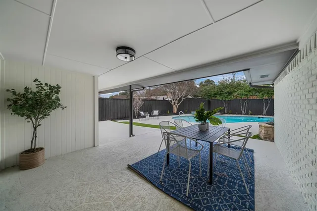 a table and chairs in a patio
