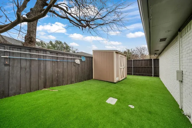 a view of a backyard with a cabin