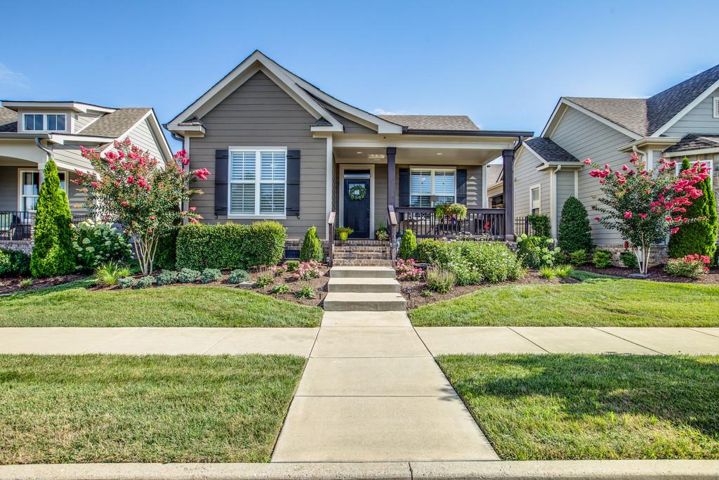 4128 Turnberry Road Spring Hill, TN 37174 - Photo 1 of 30 a front view of a house with garden