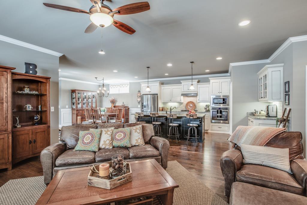 4128 Turnberry Road Spring Hill, TN 37174 - Photo 11 of 30 a living room with furniture kitchen view and a chandelier
