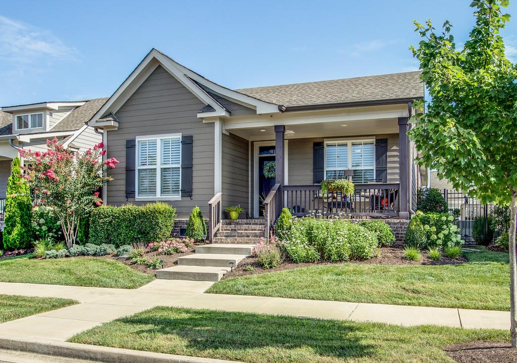 4128 Turnberry Road Spring Hill, TN 37174 - Photo 2 of 30 a front view of a house with a yard and potted plants