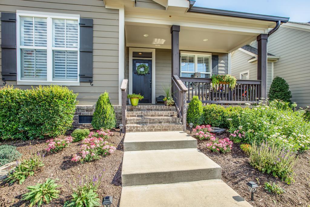 4128 Turnberry Road Spring Hill, TN 37174 - Photo 3 of 30 a view of a house with potted plants