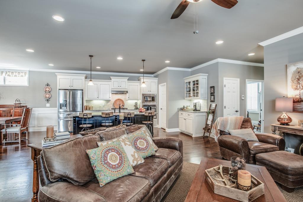 4128 Turnberry Road Spring Hill, TN 37174 - Photo 9 of 30 a living room with furniture and a view of kitchen