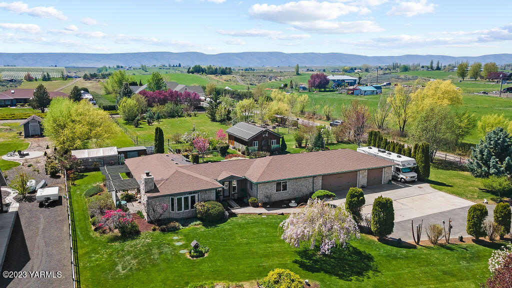15010 Fisk Road Yakima, WA 98908 - Photo 2 of 45 a view of a house with a yard and garden