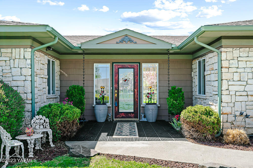 15010 Fisk Road Yakima, WA 98908 - Photo 7 of 45 a front view of house with yard outdoor seating and barbeque