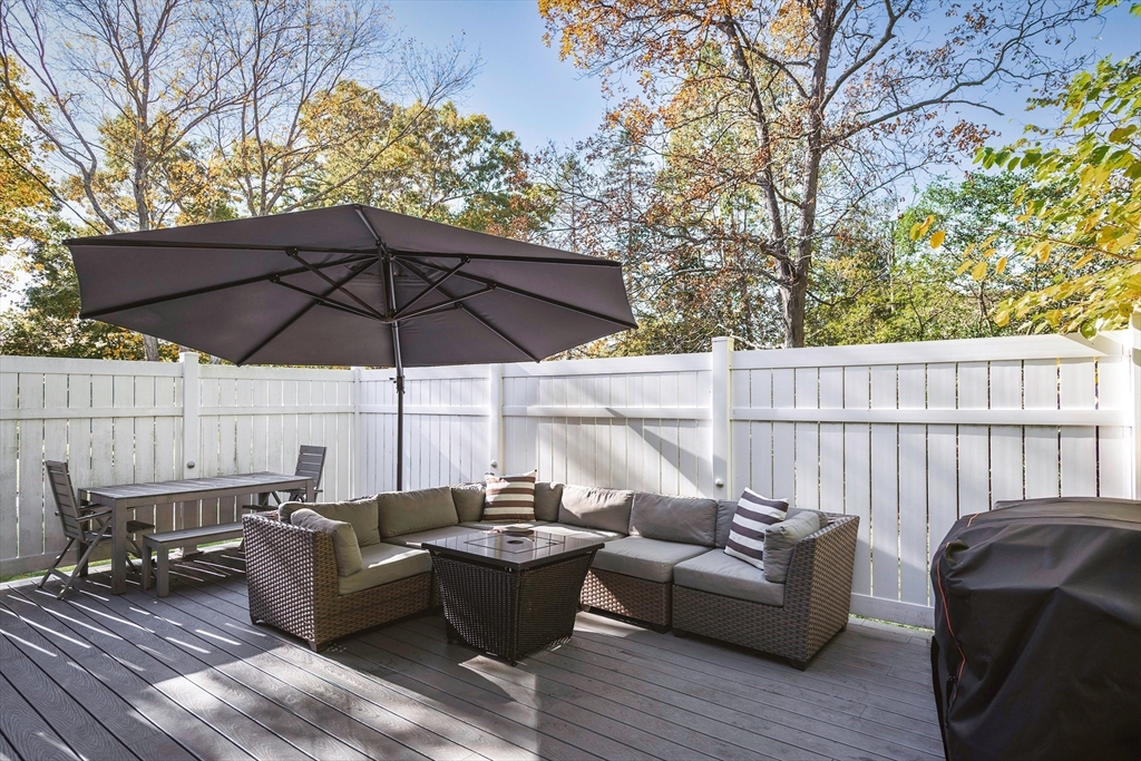 8 Old Essex Road Ipswich, MA 01938 - Photo 22 of 42 an outdoor living room with furniture and wooden floor