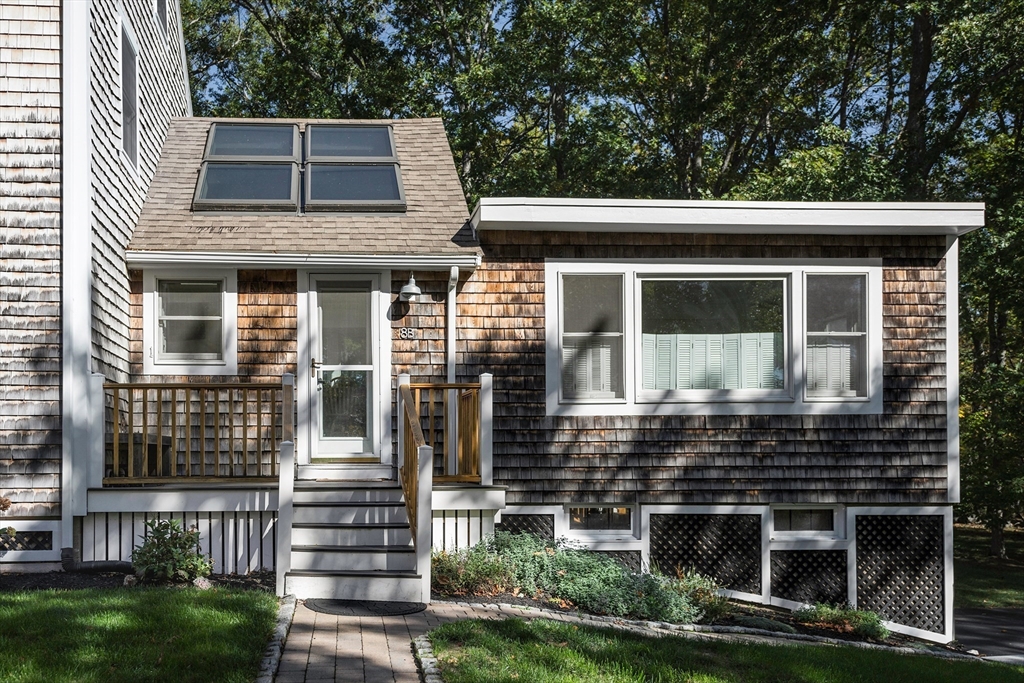 8 Old Essex Road Ipswich, MA 01938 - Photo 24 of 42 a view of a house with a yard and plants