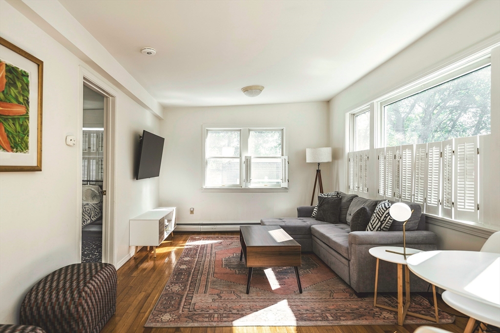 8 Old Essex Road Ipswich, MA 01938 - Photo 29 of 42 a living room with furniture and a large window