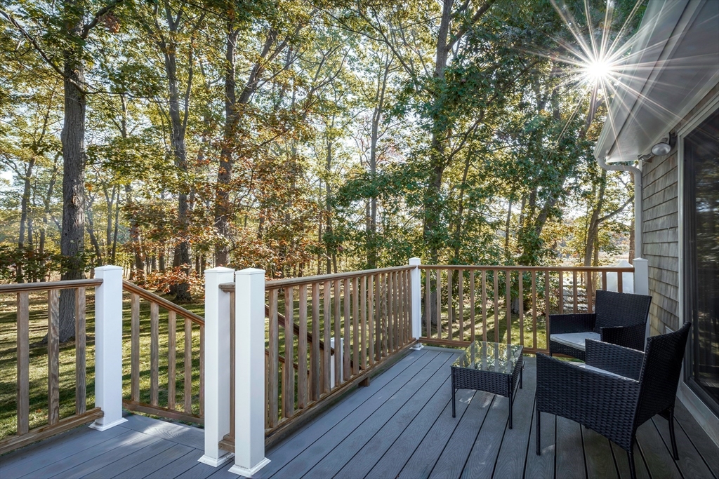 8 Old Essex Road Ipswich, MA 01938 - Photo 30 of 42 a balcony with wooden floor and outdoor seating