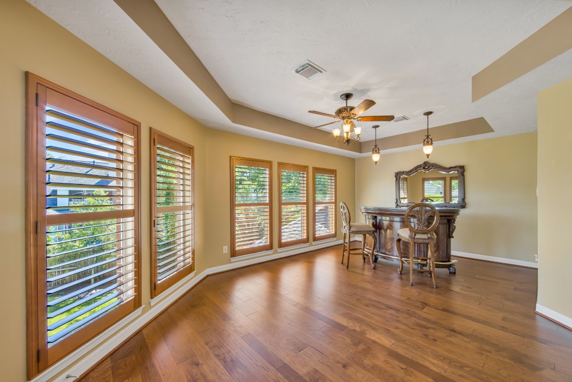 10410 Kilbride Way Court Spring, TX 77379 - Photo 34 of 49 Ready for a game of cards? The game room is ready with hardwood floors, stained plantation shutters and a door leading to the 2nd floor balcony.