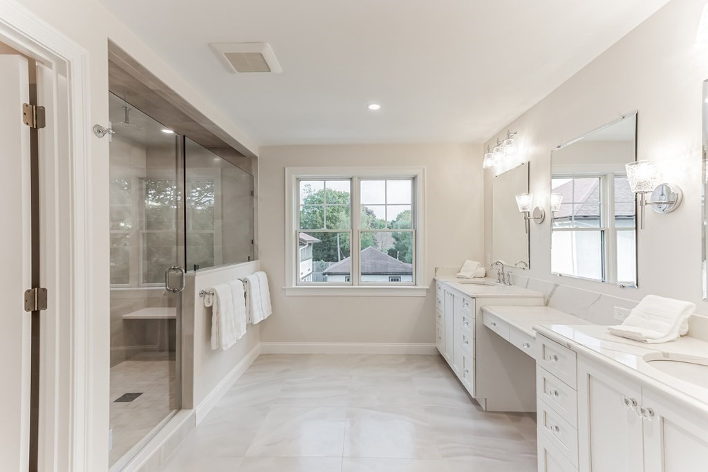 185 Hillside Avenue, Unit 185 Needham, MA 02494 - Photo 16 of 32 a large bathroom with a tub sink shower and mirror