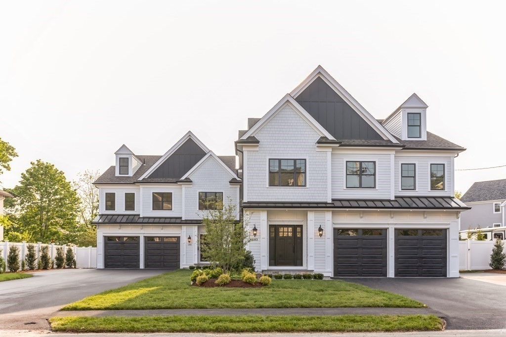 185 Hillside Avenue, Unit 185 Needham, MA 02494 - Photo 2 of 32 a front view of a house with a yard