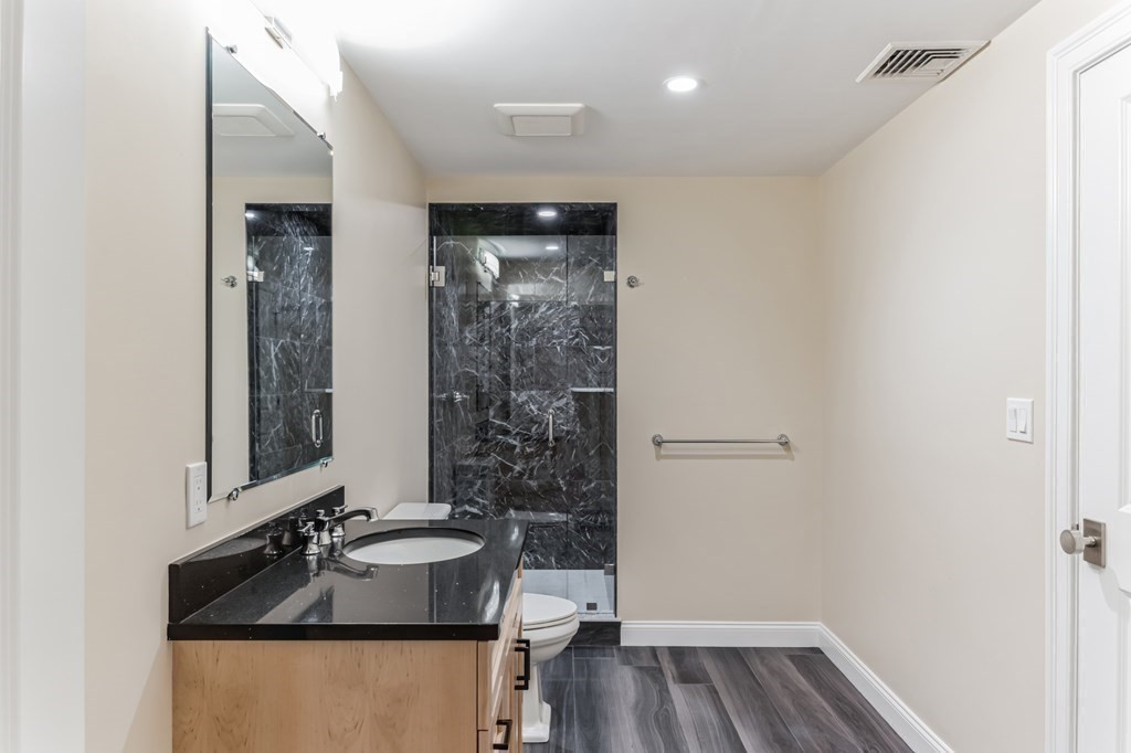 185 Hillside Avenue, Unit 185 Needham, MA 02494 - Photo 26 of 32 a bathroom with a sink and a mirror