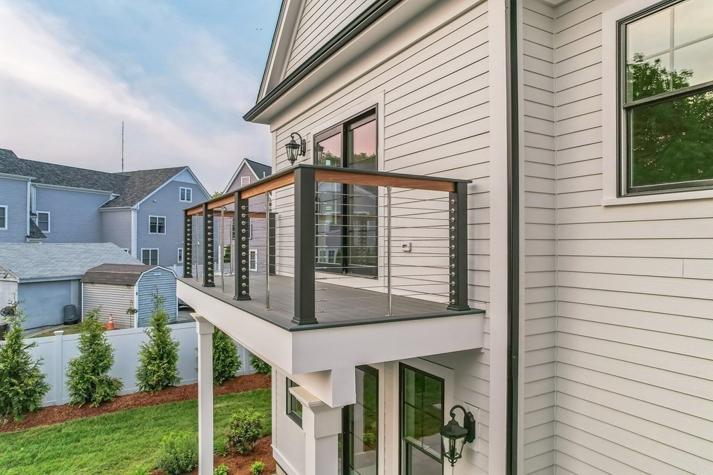 185 Hillside Avenue, Unit 185 Needham, MA 02494 - Photo 28 of 32 a front view of a house with balcony