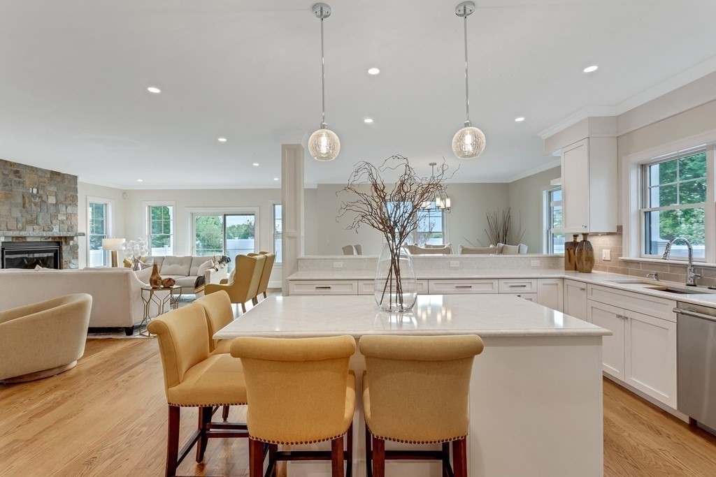 185 Hillside Avenue, Unit 185 Needham, MA 02494 - Photo 3 of 32 a large kitchen with a table and chairs