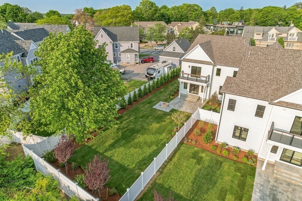 185 Hillside Avenue, Unit 185 Needham, MA 02494 - Photo 31 of 32 an aerial view of residential houses with outdoor space and trees